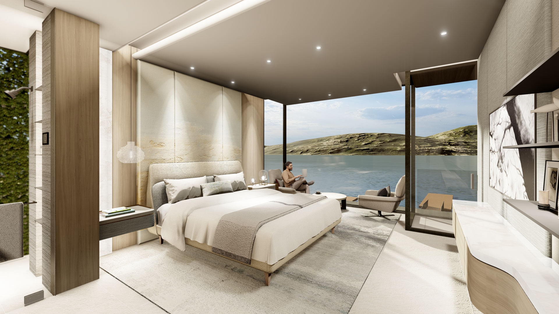 Luxurious hotel suite bedroom with a king bed, beige furnishings, and a seating area, overlooking a lake and rolling hills through floor‑to‑ceiling glass doors.