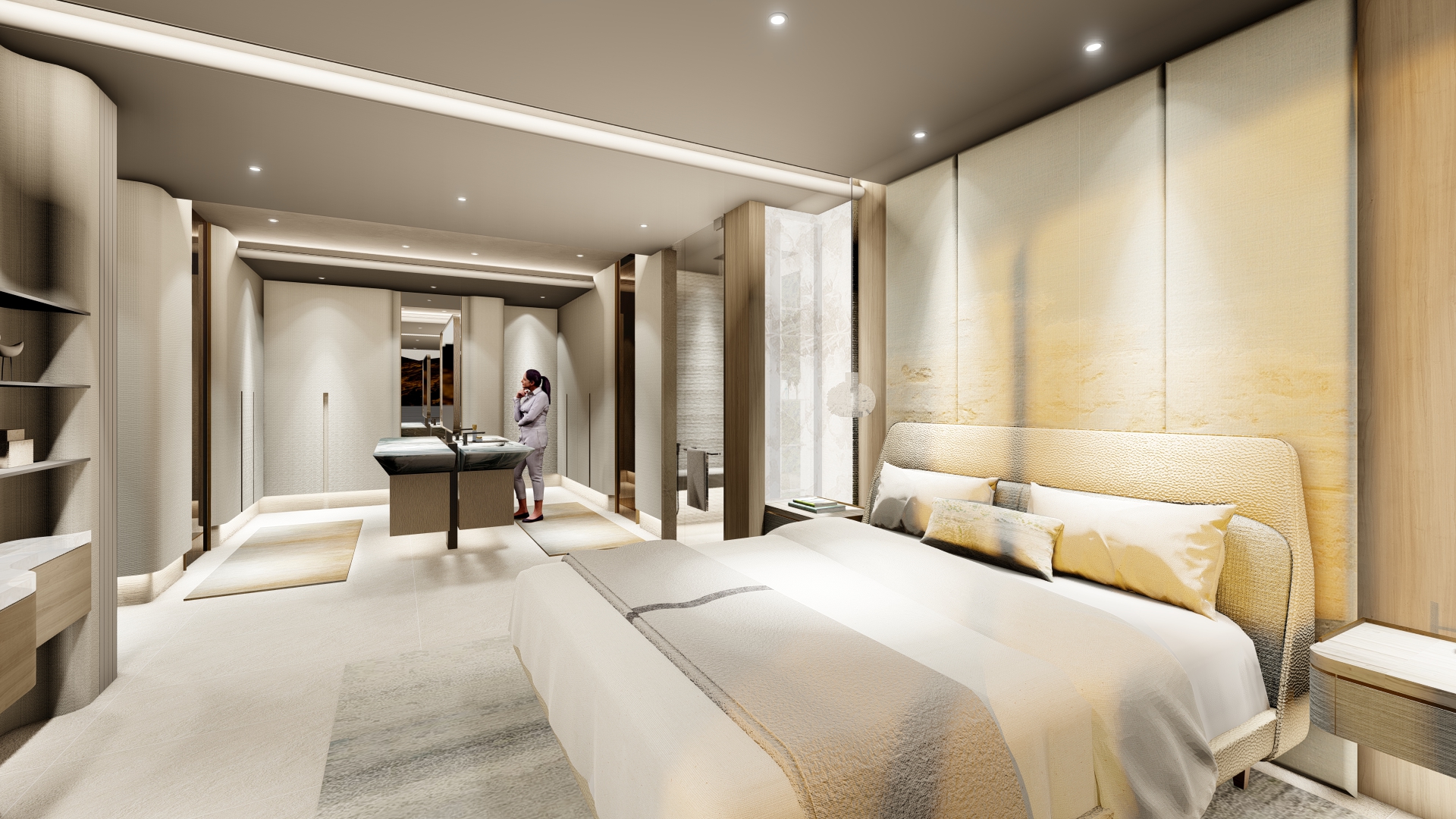 Luxurious hotel bedroom with two queen beds, neutral beige decor, and a person at a vanity area by a mirror.